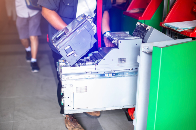 Field crew member servicing equipment